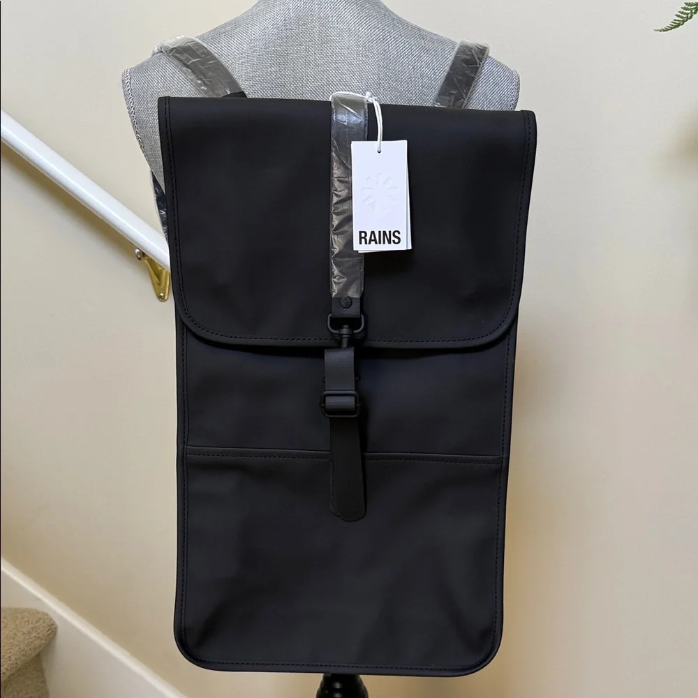 Rains Black Backpack. Clean and ever contemporary.
